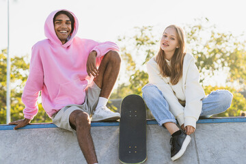 Wall Mural - Multiracial group of young friends bonding outdoors