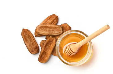 Wall Mural - Top view of Natural dried banana (Kluai namwa) with honey isolated on white background.