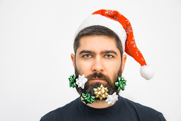 Bearded Santa Claus with Christmas decorations on an isolated background. Emotion.