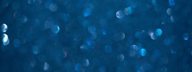 background of abstract glitter lights. blue and black