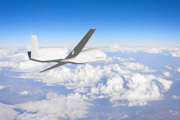 Wall Mural - Unmanned aerial vehicle flying high in the sky above the clouds in the upper atmosphere, mission. Elements of this image furnished by NASA.