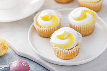 Wall Mural - Lemon cupcakes for Easter on a white plate