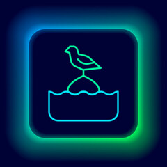 Sticker - Glowing neon line Seagull sits on a buoy in the sea icon isolated on black background. Colorful outline concept. Vector