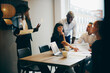 © Flamingo Images - Businesspeople working in an meeting room