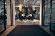 © Flamingo Images - Businessmen working in an office lounge