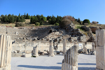 columns on the ruins of ancient city Ephesus in Turkey under blue sky