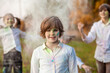 © Svetlana - Child playing with color in holi festival. Holi celebrations, girl playing holi in India.