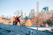© travnikovstudio - Family of father and kids in Central Park during their vacation in New York City