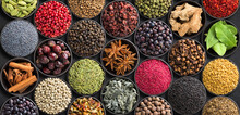 Fresh Spices And Herbs For Food. Colorful Condiments As Background, Top View. Lot Seasonings In Cups, On Table