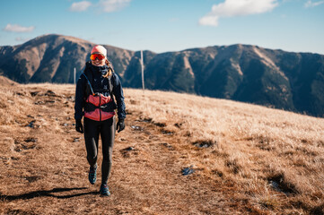 Traveler hiking  with backpacks. Hiking in mountains. Sunny landscape. Tourist traveler on background view mockup. High tatras , slovakia