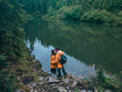 couple hikers near lake