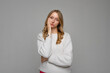 © Red Cristal - Young blonde woman standing over gray background thinking looking tired and bored with depression problems