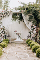 Wall Mural - Morden wedding floral decor outside.Artificial rose and white flowers