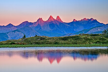 Reflection Of Famous Mountain In Lac Guichard Lake At Sunset, France
