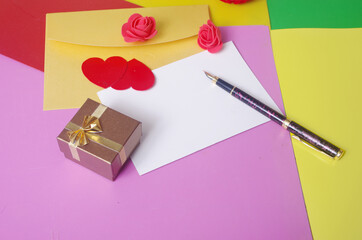 Wall Mural - Love letter. Envelopes, empty blank, red hearts, fountain pen on a colored background. Place for an inscription.