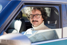 Man With Eyeglasses Sitting Inside Car