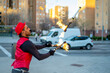 © Westend61 - Street performer juggling flaming torches in city