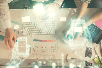 Aufkleber - Double exposure of man and woman working together and the envelop hologram drawing. Computer background. Top View. Electronic mail concept.