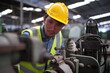 © FotoArtist - Male engineer metalworker industrial experienced operator technician worker in safety hard helmet working on lathe machine, professional man in industry technology manufacturing factory workshop