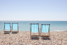 UK, Brighton, Deckchairs On Beach