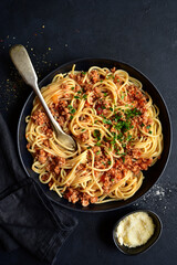 Wall Mural - Traditional italian spaghetti bolognese with minced meat and tomato sauce. Top view with copy space.