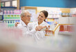 He's well taken care of. Shot of a young pharmacist helping an elderly customer.