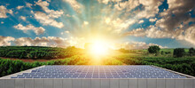 Beautiful Sunset Over Solar Panel Photovoltaic Company Building Farm. Solar Farm Over A Cloudy Sunny Sky.