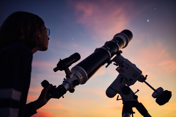 Canvas Print - girl with astronomical telescope stargazing under twilight sky.