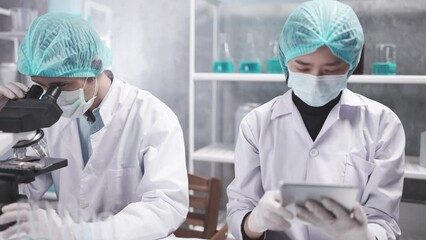 Wall Mural - scientist team has researching in the laboratory, meeting and writing analysis results of coronaviru