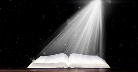 Wall Mural - Bible. Open book. Light from a book. Old antique book. Magic, fairy tale.