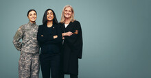 Smiling Women From Different Goverment Professions Standing In A Studio