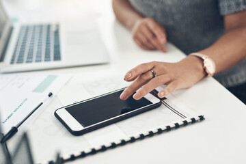 Sticker - Completing business operations from her phone. Closeup shot of an unrecognisable businesswoman using a cellphone in an office.