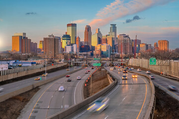 Wall Mural - Beautiful Minneapolis downtown city skyline with traffic light at sunset