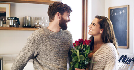 Sticker - Beautiful roses for my beautiful wife. Shot of a young man surprising his wife with a bunch of roses at home.