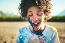 Summer Days Are Super Fun Days. Shot Of A Teenage Boy Having Fun With Colourful Powder At Summer Camp.