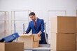 © Elnur - Young male employee in relocation concept