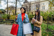 © DusanJelicic - Two beautiful young women with shopping bags walking down the street