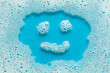 © Andrii Zastrozhnov - House cleaning. Smiley from foam detergent on a blue background. Soap suds and bubbles.