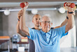 You can do it. Shot of a physiotherapist helping a senior man with weights.