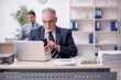 © Elnur - Two male employees working in the office