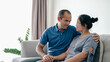 © Suriyawut - Portrait of Asian mature couple sitting in the living room. wife and husband hugging, holding hand with happiness and cheerful. Love, safety, and insurance family concept.