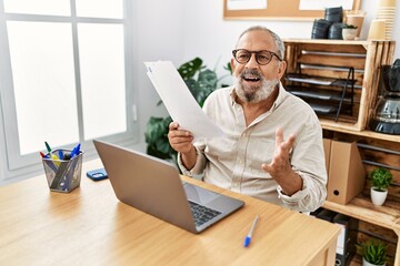 Poster - Senior grey-haired man smiling confident working at office