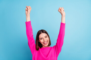 Wall Mural - Photo portrait woman wearingpink pullover happy gesturing like winner isolated pastel blue color background