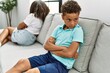 © Krakenimages.com - Brother and sister angry having problem sitting on sofa at home
