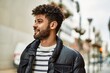 © Krakenimages.com - Young arab man smiling outdoor at the town
