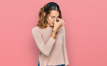 Beautiful Young Caucasian Woman Wearing Casual Sweater Tired Rubbing Nose And Eyes Feeling Fatigue And Headache. Stress And Frustration Concept.