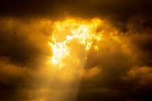 Light Of Sun From Dark Clouds Like Heaven. Sunlight Sunbeam Or Sunray Through The Clouds.