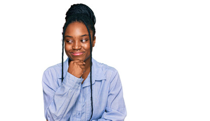 Sticker - Young african american woman wearing casual clothes with hand on chin thinking about question, pensive expression. smiling with thoughtful face. doubt concept.