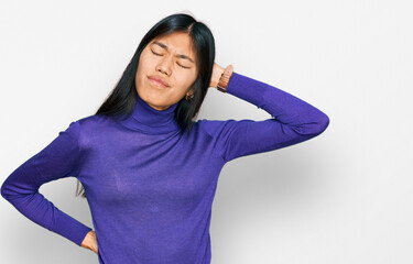 Sticker - Beautiful young asian woman wearing casual clothes suffering of neck ache injury, touching neck with hand, muscular pain