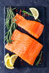 Wall Mural - Fresh salmon fish fillet on slate plate